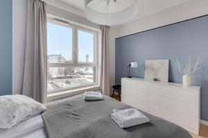 Posteľ alebo postele v izbe v ubytovaní Grand Apartments - Bastion Wałowa Modern Apartament Gdańsk