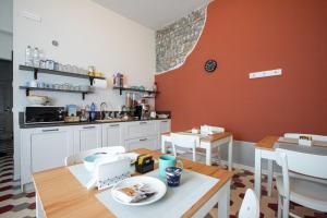 a kitchen with a table and a dining room at Casa Livia in Pordenone