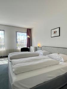 Postelja oz. postelje v sobi nastanitve City Hotel Fortuna Reutlingen