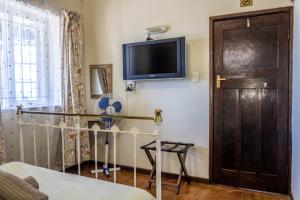 TV a/nebo společenská místnost v ubytování Bay Vista Guesthouse
