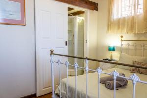 Postel nebo postele na pokoji v ubytování Bay Vista Guesthouse