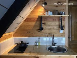 a kitchen with a sink and a counter top at Camp Lipovo in Kolašin