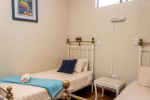 Postel nebo postele na pokoji v ubytování Bay Vista Guesthouse