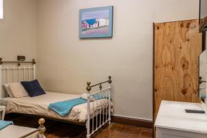 Postel nebo postele na pokoji v ubytování Bay Vista Guesthouse