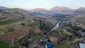 an aerial view of a river and mountains at Orchy Bank House in Dalmally