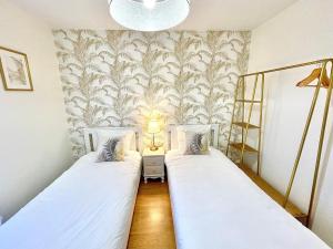 Postel nebo postele na pokoji v ubytování Bel'Apparté