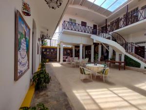 a room with a table and chairs in a building at Las Catalinas Anton Panama in Antón