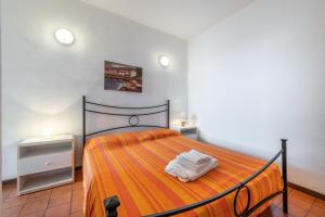 Postel nebo postele na pokoji v ubytování Accu is Prezzus C fronte mare