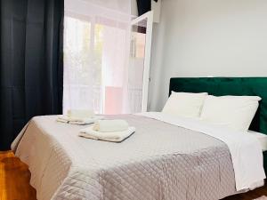 Ein Bett oder Betten in einem Zimmer der Unterkunft Acropolis Select Flat