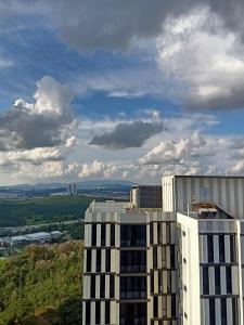 a view of a tall white building with a sky at Malaysia Johor Medini Studio in Nusajaya