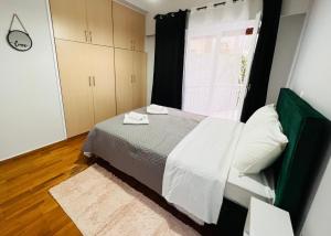 Ein Bett oder Betten in einem Zimmer der Unterkunft Acropolis Select Flat
