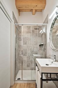 a bathroom with a shower and a sink at Crocevia - Locanda carsica contemporanea in Trieste