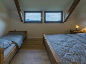 Postel nebo postele na pokoji v ubytování Apartmán pod Pustým vrchem