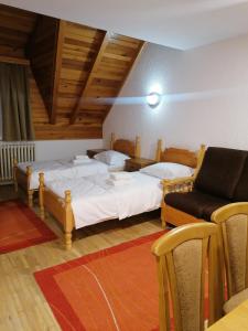 En eller flere senger på et rom på Guest House Villa Rankovic