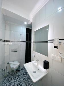Koupelna v ubytování Nefis Hotel City