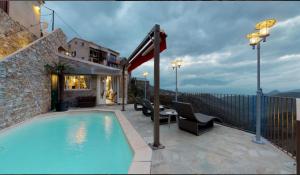 a swimming pool on the side of a building at Casa Di Lucia Mi-Hotel in Mazzola