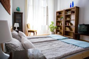 Ένα ή περισσότερα κρεβάτια σε δωμάτιο στο Sipi Apartman