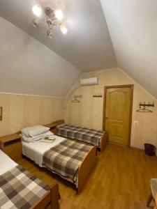 Postel nebo postele na pokoji v ubytování Inn Khlibodarskiy