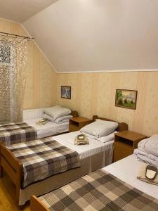 Postel nebo postele na pokoji v ubytování Inn Khlibodarskiy