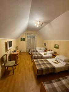 Postel nebo postele na pokoji v ubytování Inn Khlibodarskiy + 37 fotografií