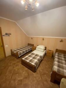Postel nebo postele na pokoji v ubytování Inn Khlibodarskiy