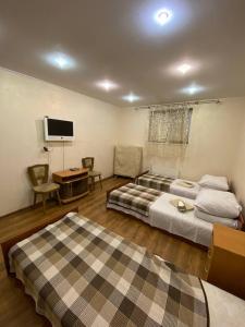Postel nebo postele na pokoji v ubytování Inn Khlibodarskiy