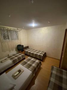 Postel nebo postele na pokoji v ubytování Inn Khlibodarskiy