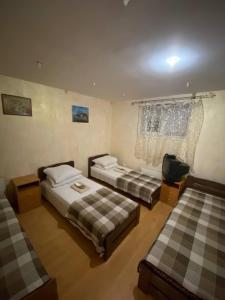 Postel nebo postele na pokoji v ubytování Inn Khlibodarskiy