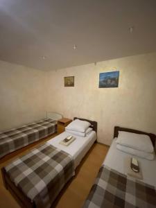 Postel nebo postele na pokoji v ubytování Inn Khlibodarskiy