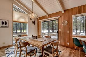 a dining room with a wooden table and chairs at Golf Home 53 in Black Butte Ranch