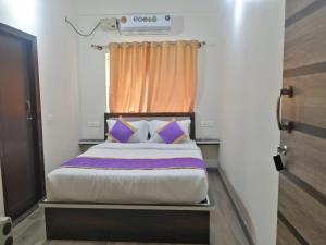 Postel nebo postele na pokoji v ubytování SM Rooms HSR Layout Bengaluru