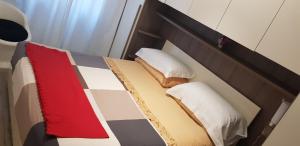 Voodi või voodid majutusasutuse Al Borgo Di Priaruggia toas