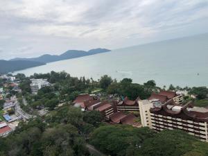 an aerial view of a city and the ocean at Beach Resort Home Stay 25 Batu Ferringhi Penang in Batu Ferringhi