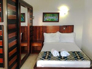 Postel nebo postele na pokoji v ubytování La Bocana de Quiximies Hotel