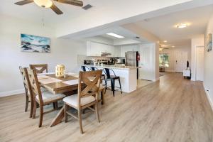 a dining room and kitchen with a table and chairs at The Waterman's Retreat Unit N in Fort Lauderdale