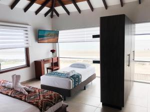 Postel nebo postele na pokoji v ubytování La Bocana de Quiximies Hotel