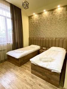 Postel nebo postele na pokoji v ubytování Glendale Boutique Hotel