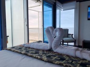 Postel nebo postele na pokoji v ubytování La Bocana de Quiximies Hotel