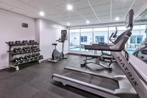 a gym with a treadmill and elliptical machines at Staybridge Suites Pittsburgh Airport by IHG in Beechcliff +47 photos