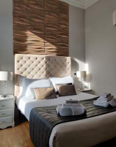 מיטה או מיטות בחדר ב-Corso Experience
