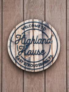 a sign on the side of a wooden wall at Highland House: Lakefront, Hot Tub, Views, Private in East Stroudsburg