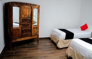 Postel nebo postele na pokoji v ubytování Hotel Boutique Don Porfirio