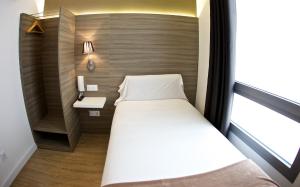 Postel nebo postele na pokoji v ubytování Hotel BESTPRICE Diagonal