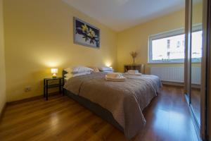 Łóżko lub łóżka w pokoju w obiekcie Komfortowy Apartament w centrum Ustronia