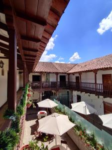 a view of the courtyard of a hotel with umbrellas at Puma walkers in Cusco