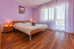 Posteľ alebo postele v izbe v ubytovaní Apartments FILIP