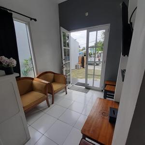 a living room with a couch and a table at Rumah Baraka in Yogyakarta