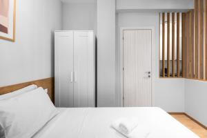 Posteľ alebo postele v izbe v ubytovaní Aelia Apartments, The Luxury Suites