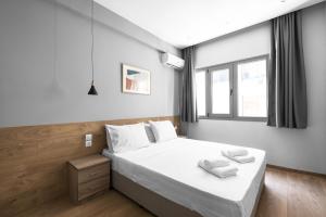 Posteľ alebo postele v izbe v ubytovaní Aelia Apartments, The Luxury Suites