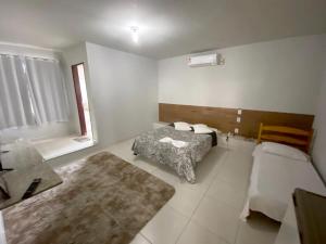 ARCO HOTEL tesisinde bir odada yatak veya yataklar